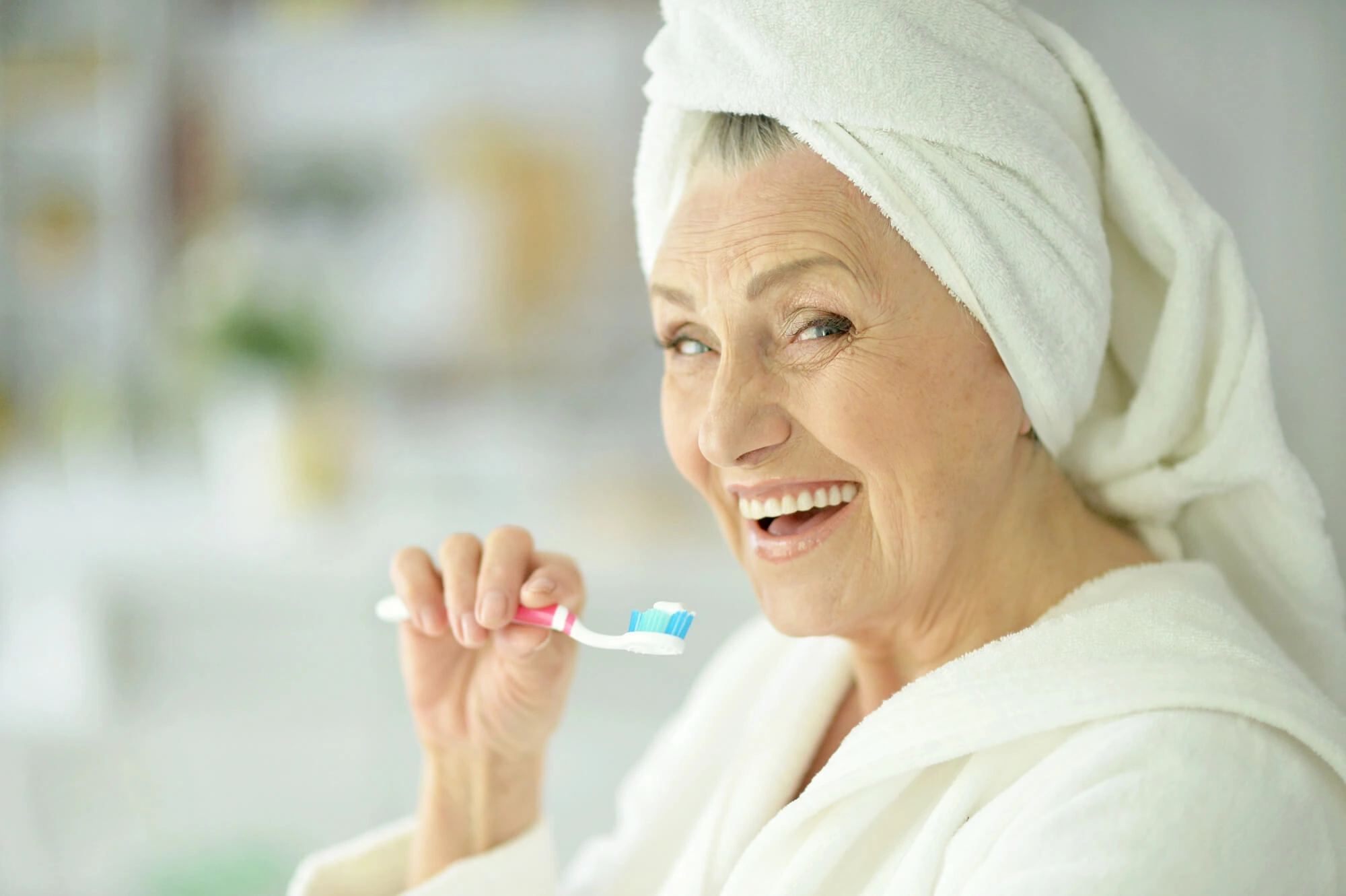senior-brushing-teeth-before-seeing-a-dentist-in-Mount-Holly-NC