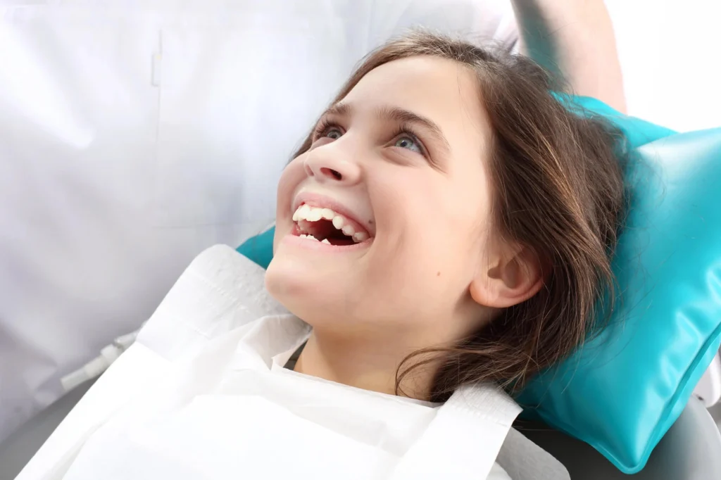 Child smiling during mount holly dentistry visit
