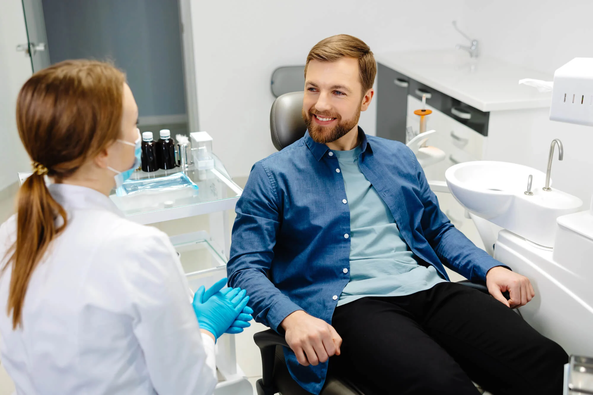 Patient discussing Mount Holly dental crowns with the dentist