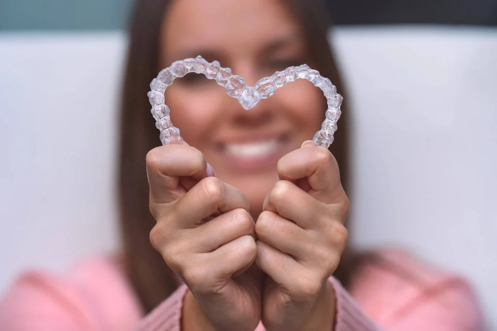Patient holding Mount Holly Invisalign